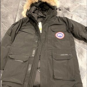 This Canada goose parka has the tags on it still, as well as the hologram tag.